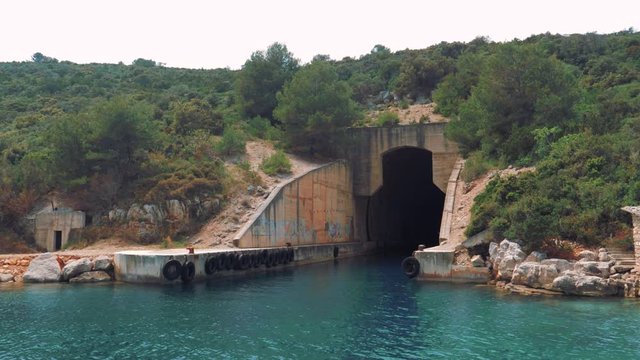 A boat approaching a submarine/military tunnel. History in Croatia.