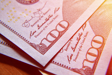 Obraz premium Dolar USA close up. Macro texture of a fragment of the dollar bill. USD banknote texture. One hundred American dollars macro.