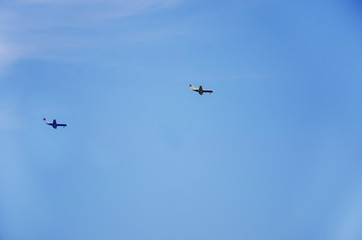 two planes in the blue sky