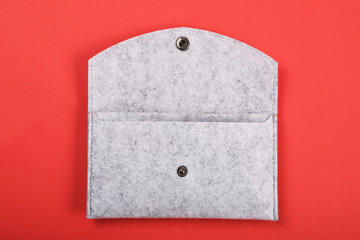 Felting wallet on the red background