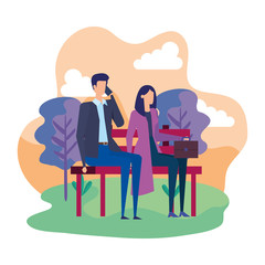 business couple calling with cellphone in the park chair