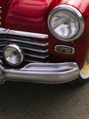 Fototapeta na wymiar part of a red classic vintage car