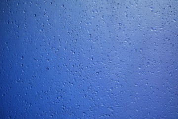 water drop on blue plastic texture