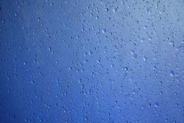 water drop on blue plastic texture