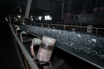 Black coal on a conveyor belt. The production process in the Thermal Power Plant. - 281599462