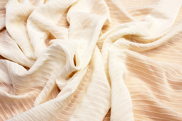 Silk fabric texture with ivory synthetics. Background, pattern.
