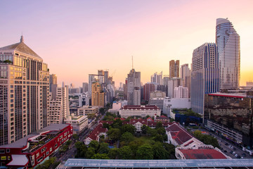Panorama of landscape with sunset over the building and blue sky at bangkok ,Thailand. View of the tall building in capital with twilight .Shot using Panorama technique.