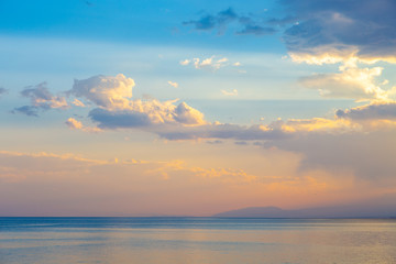 Fototapeta na wymiar sky sunset sea. Beautiful clouds, soft colors. Natural background