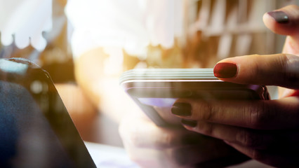 Hands with mobile, double exposure