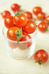  Fresh cherry tomatoes on white wooden table. Organic vegetables, healthy and dieting food, soft focus
