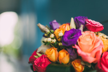 Beautiful wedding bouquet of different flowers. Roses, spray roses. Wedding day. Bokeh. Bride....