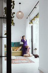 female with short haircut poses in Tbilisi loft