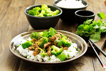 Beef with broccoli and rice. Asian cuisine.