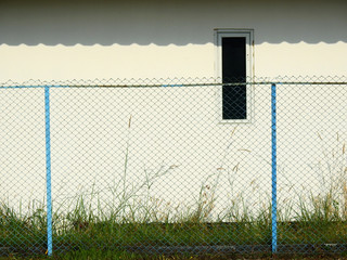 Fototapeta premium wire mesh of fence in abandoned place
