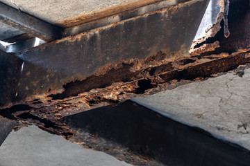 Rust on steel structural columns & post floor support.