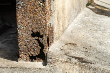 Rust on steel structural columns & post floor support.