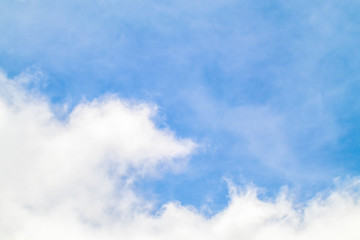 Obraz premium The white clouds in the light blue sky in the sunny day.