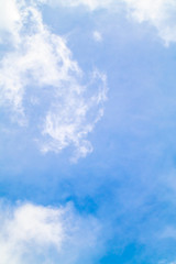 The white clouds in the light blue sky in the sunny day.