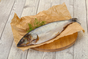 Salted herring over the wooden board