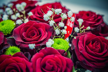 Colorful flower bouquets on desk as a gift
