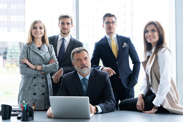 Businesspeople discussing together in conference room during meeting at office.
