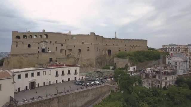 Aerial view of the Castle of Sant'Elmo in Naples. Flight of the drone over the castle overlooking the bay and city blocks.