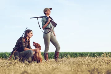 Fototapeten Women hunters with hunting dog  © zorandim75
