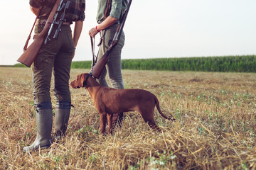 Women hunters with hunting dog 