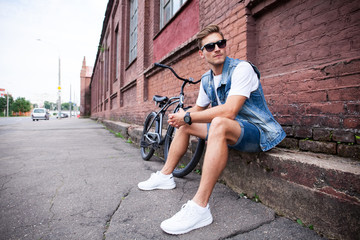 portrait of a trendy young man in the city.