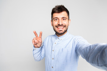 Close up portrait of satisfied handsome careless restless with beaming toothy smile blogger...
