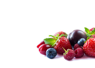 Fruits and berries on white background. Ripe strawberries, blueberries, raspberries, red berries and plums. Mix fruits on white. Mix berries with copy space for text. Various fresh summer berry.