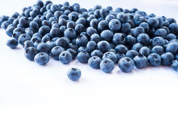 Fresh ripe blueberries with drops of dew. Macro photo. Fresh blueberry background. Texture blueberry berries close up. Ripe bilberry background. Texture bilberry berries. Blueberries picked in forest.