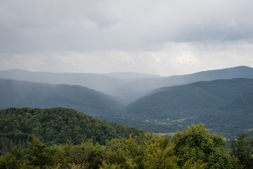 A storm is brewing over Wetlina village, seen from Połonina Wetlińska, from the approach to Smerek peak.