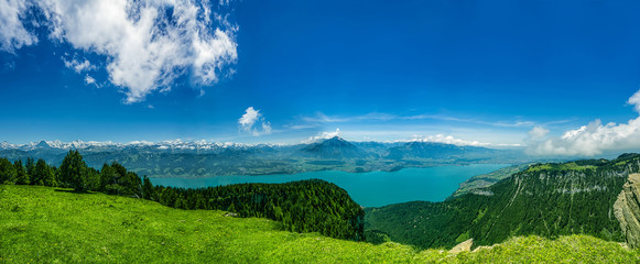 Panorama of Lake Thun and Bernese Alps including Jungfrau, Niesen, Eiger and Monch peaks from the...