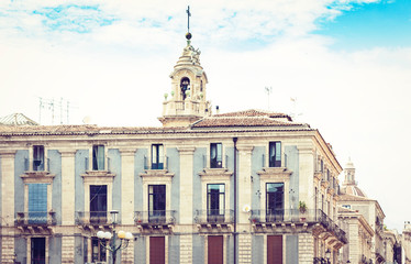 Fototapeta premium Traditional architecture of Sicily in Italy, typical street of Catania, facade of old buildings.