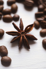 Close-up star anise and coffee beans on a white background