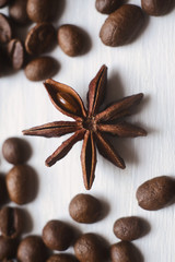 Close-up star anise and coffee beans on a white background