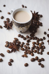 Flatlay coffee cup and coffee beans on a white background