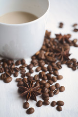 Coffee cup and coffee beans on a white background