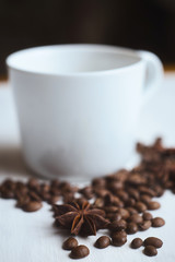Coffee cup and coffee beans on a white background