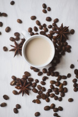 Flatlay coffee cup and coffee beans on a white background
