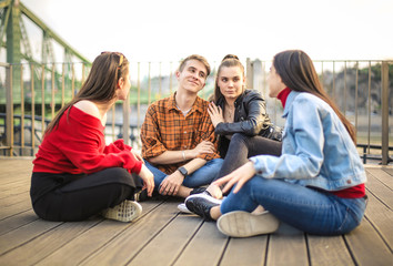 Group of teenagers sitting on a terrace