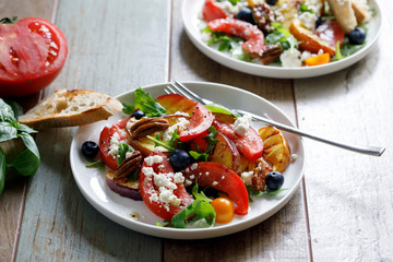 Grilled peach and heritage tomato salad