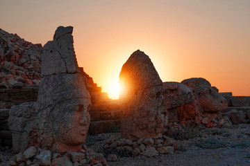 Ancient statues on the Nemrut mountain and most beautiful sunset. Unesco heritage. Nemrut, Turkey, 