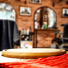 Obraz premium Table background with blurred barber salon shop view. Empty space for decoration and advertising products.