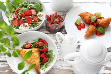 Strawberry menu. Puff pastry with ricotta, arugula curd and strawberry salad, strawberries in balsamic vinegar with green pepper, strawberry pancakes
