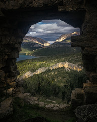 Mountain landscape through ruin door