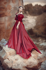 Girl in a red dress with a long skirt