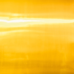Glowing in the sun golden metal texture background