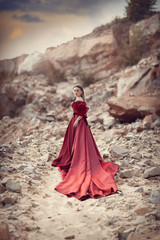 Girl in a red dress with a long skirt